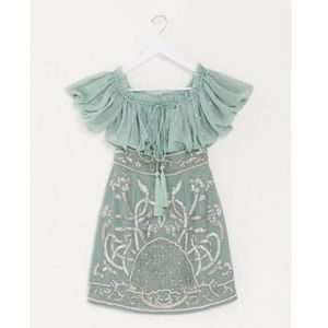 BLOUSON BODICE OFF SHOULDER MINI DRESS WITH EMBELLISHED SKIRT IN SAGE-GREEN